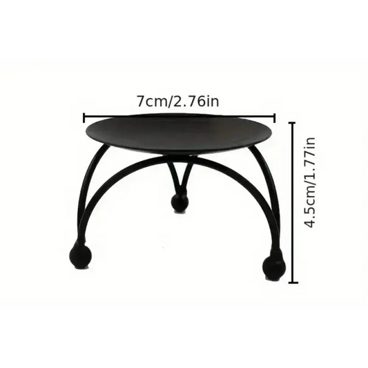 Round Black Metal Candle Stand with geometric three-legged base and 7cm diameter.