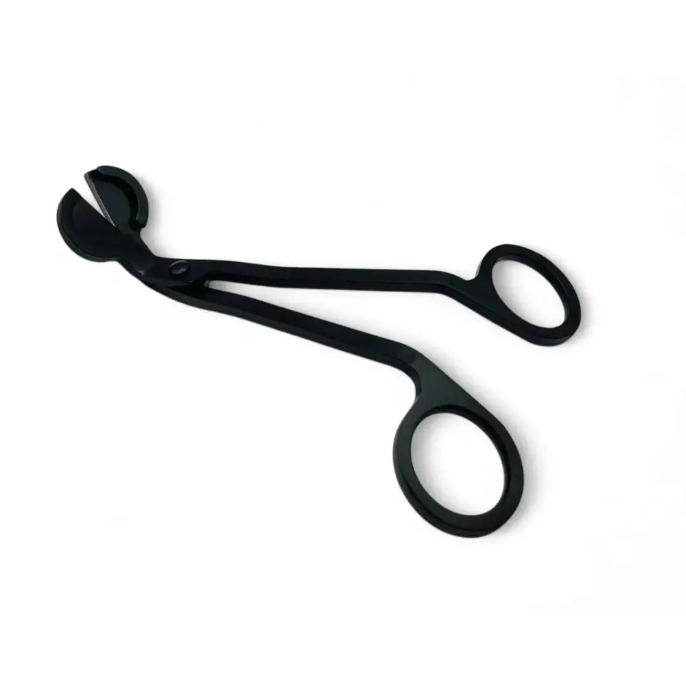 Matte black candle wick trimmer from candle care kit.