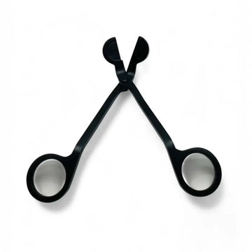 Black stainless steel wick trimmer from Candle Care Kit for clean, even candle burns.