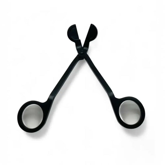 Black stainless steel wick trimmer from Candle Care Kit for clean, even candle burns.