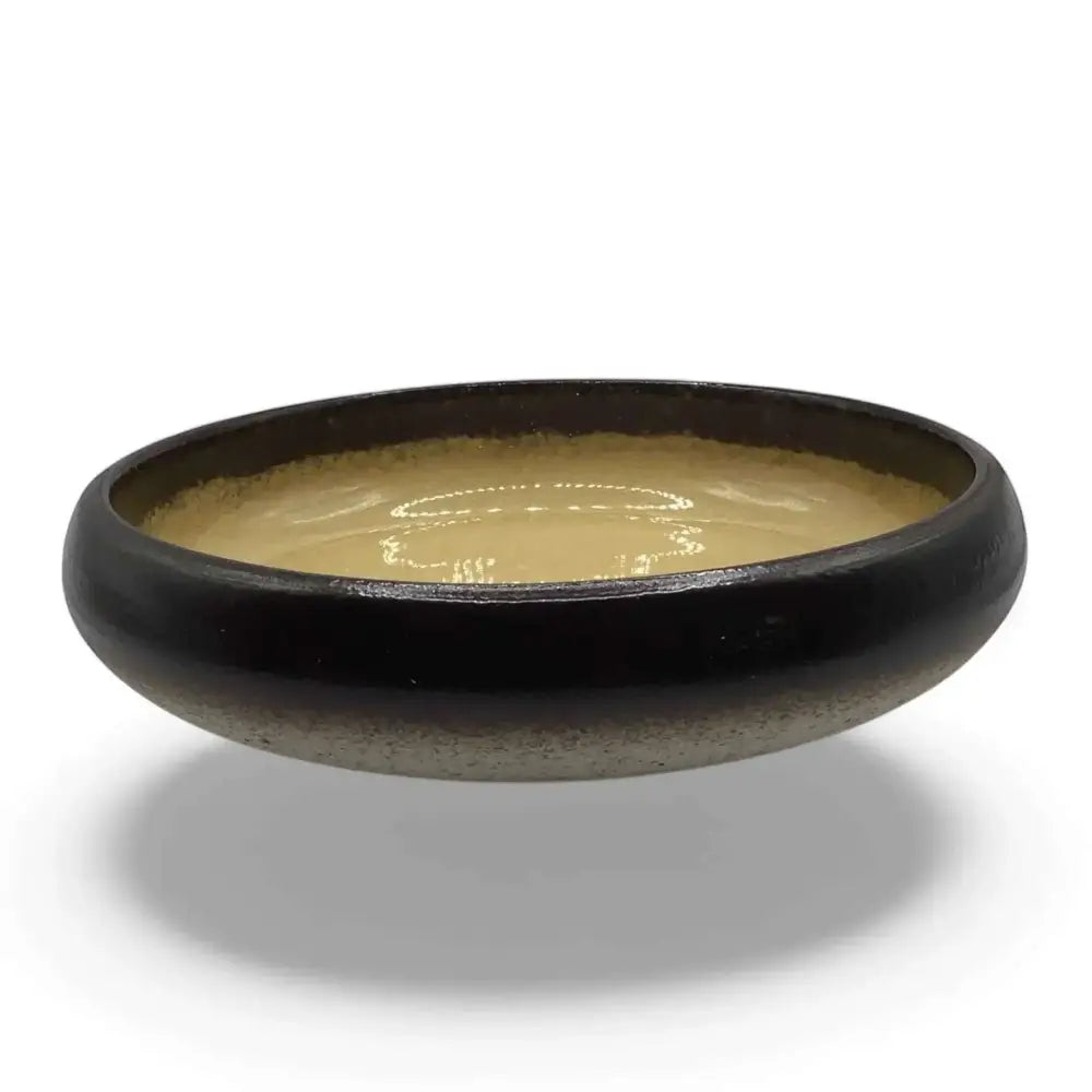 Ceramic candle holder plate, 14cm, black with beige accent, durable and heat-resistant.