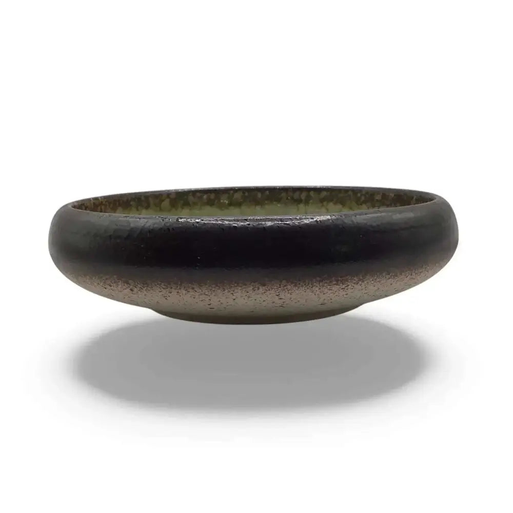 Ceramic candle holder plate, 14cm, in black with green accent, elegant and heatproof design.