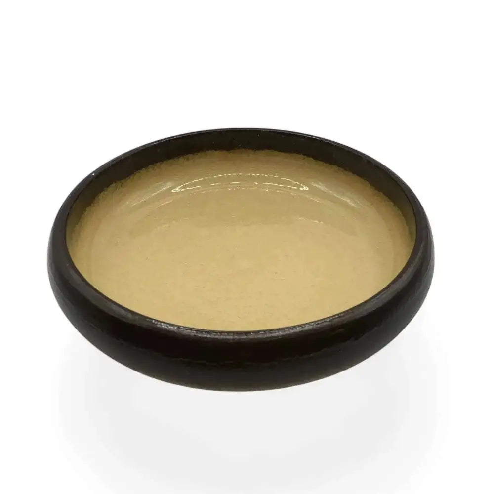 Ceramic candle holder plate 14cm in black with beige accent, elegant and heat resistant.