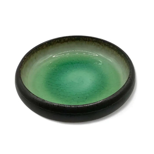 Ceramic candle holder plate with green accent, 14cm diameter.