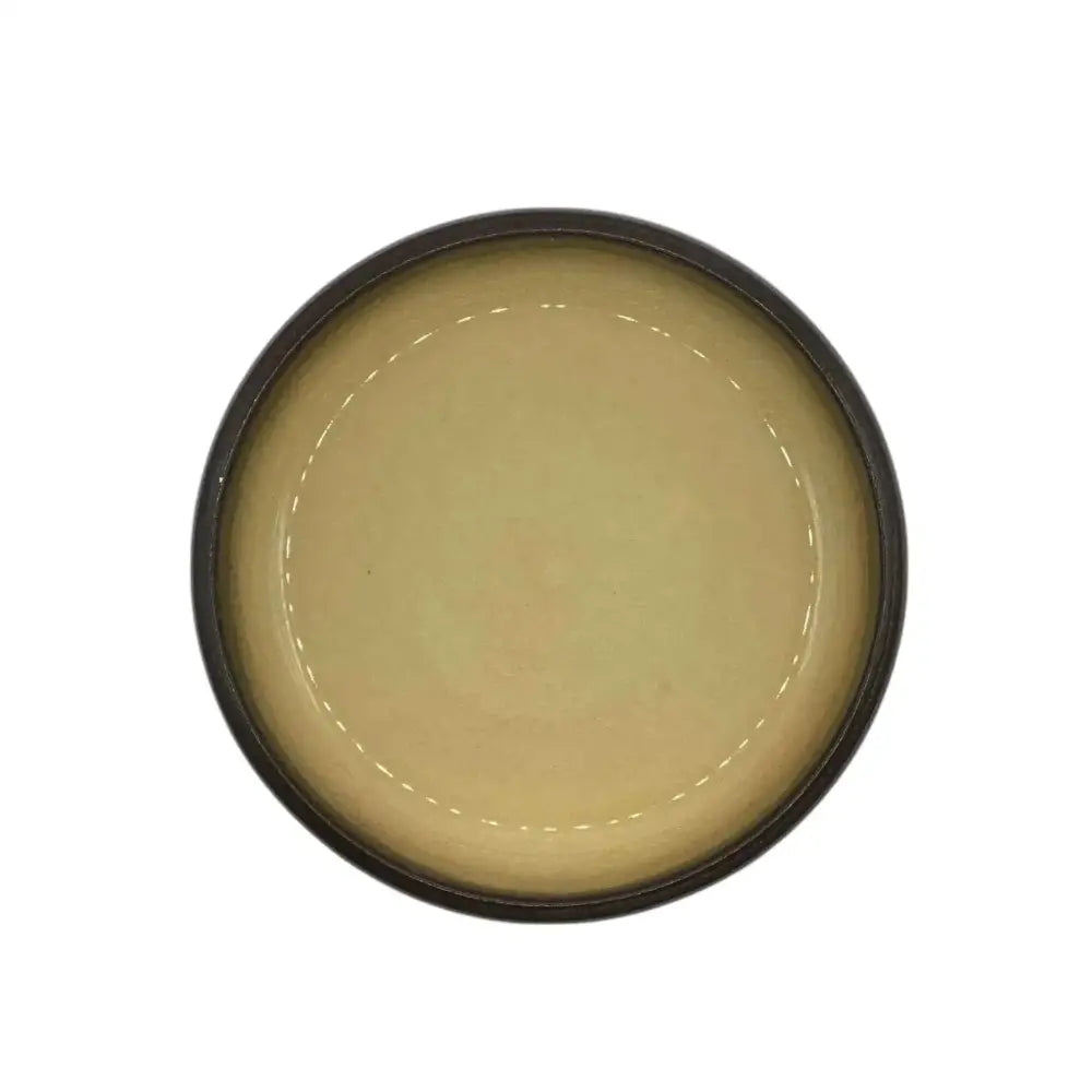 Ceramic candle holder plate in black with beige accent, 14cm diameter.