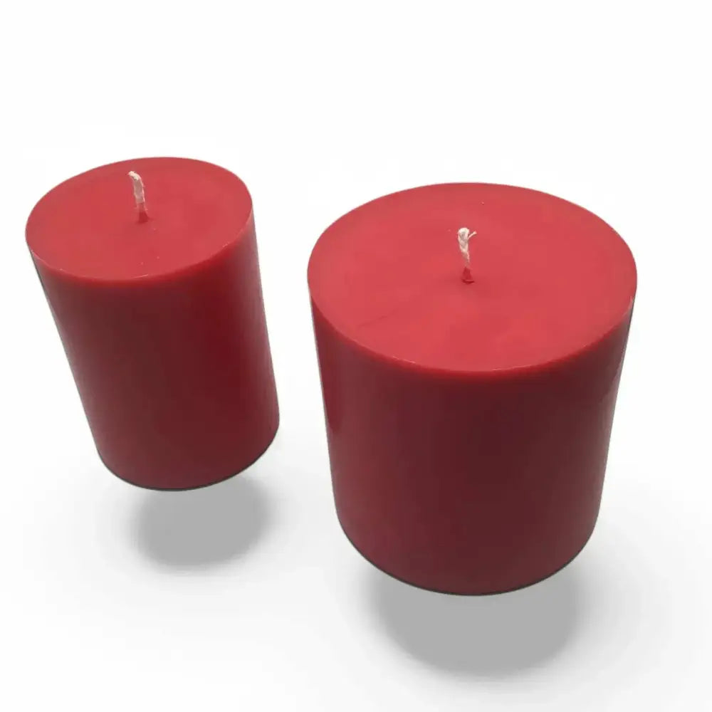 Fruit scented soy candle set of two, showcasing red pillar design against a white background.