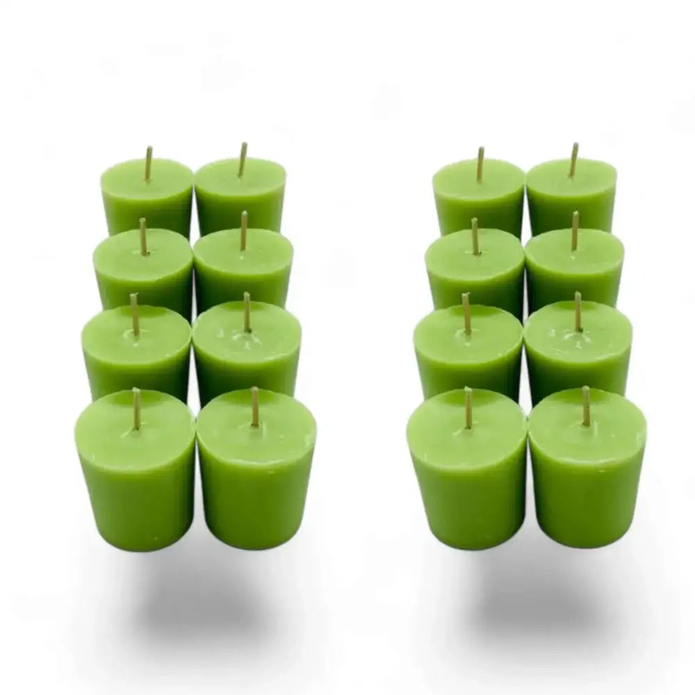 Gardenia scented soy votive candles in green, arranged in two groups.
