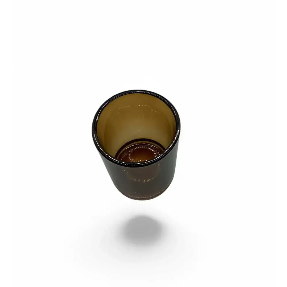 Amber glass votive candle holder with elegant design, shown in a warm, rich hue.