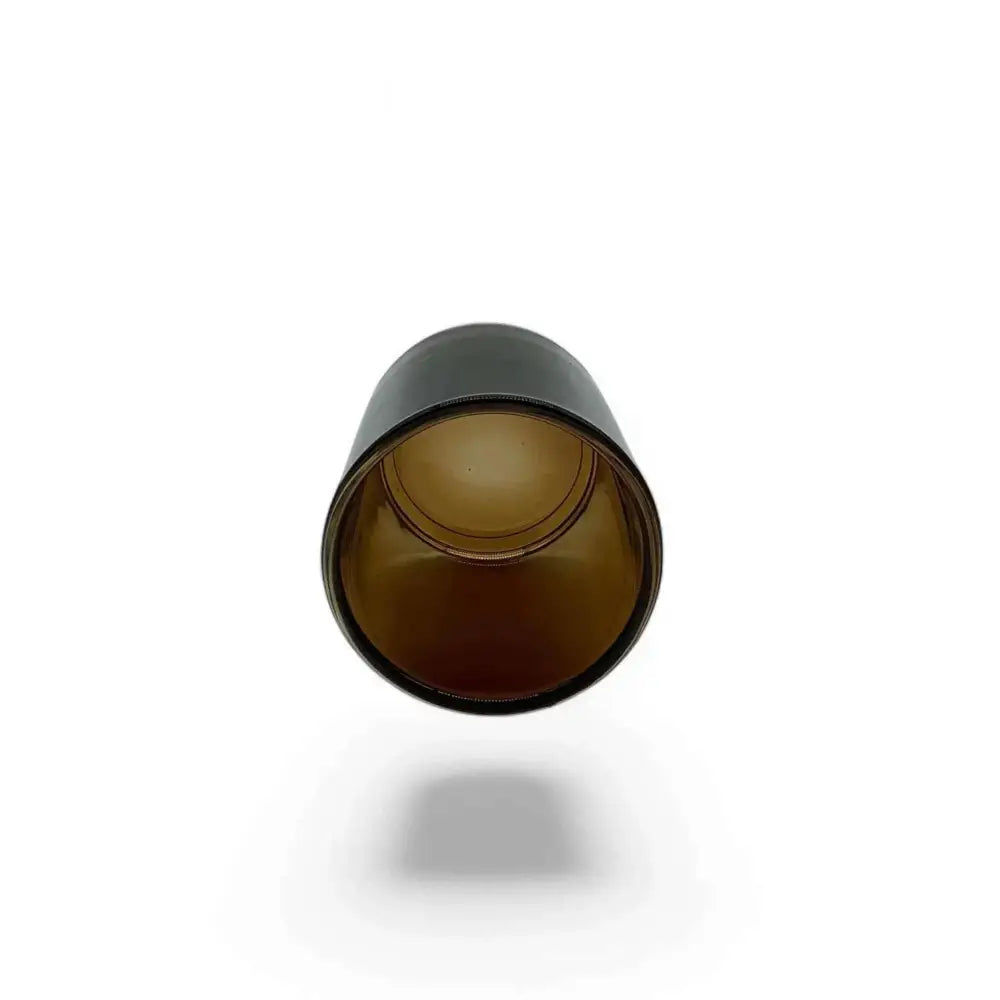 Amber glass votive candle holder with rich hue, compact 7cm height, and 5cm diameter, ideal for cozy ambiance.