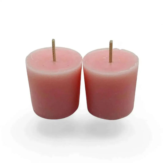 Honeysuckle votive candles with pink wax, ideal for enhancing decor and aroma.