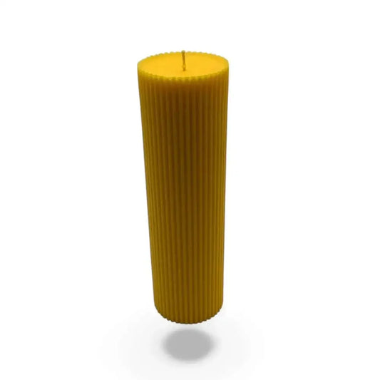 Jasmine scented soy pillar candles with ribbed design and warm yellow hue, perfect for adding floral elegance.