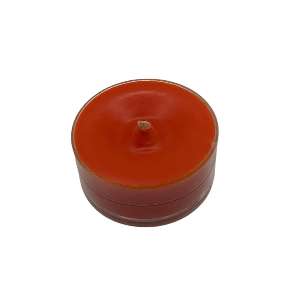 Red scented tealight candle from 10 pack box, enhances ambiance and fragrance, burns 5 hours, 4cm wide, 2cm tall, 15g. Scented Tealight Candles.