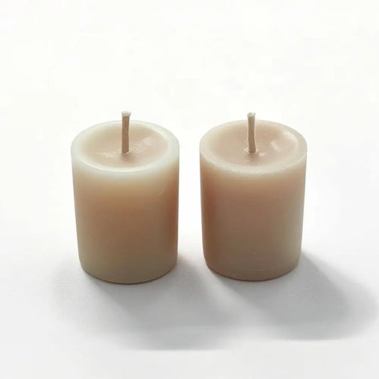 Vanilla Votive Candles made of scented soy wax, showcasing two creamy handmade candles for a warm and inviting ambiance.
