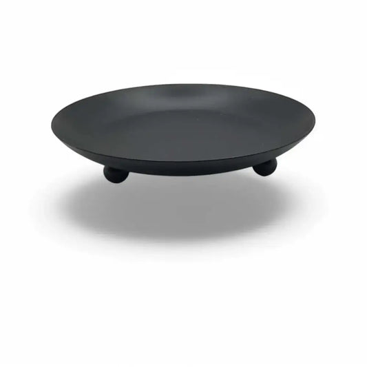 Round wrought iron candle holder with matte black finish, minimalist Nordic design.