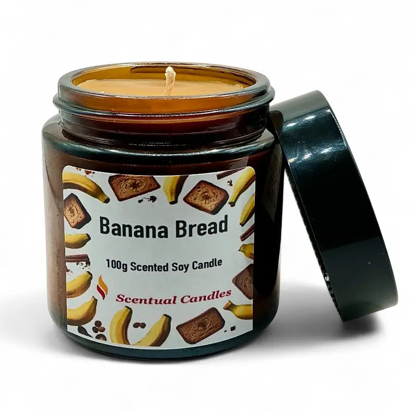 Banana Bread Candle in a glass jar with label "Scentual Candles" depicting slices of banana bread on a white background.