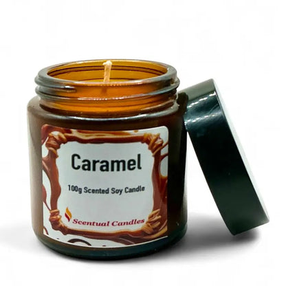 Caramel candle in an amber jar with a label on a white background