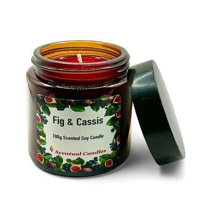Fig and Cassis scented soy candle in brown jar with open lid.