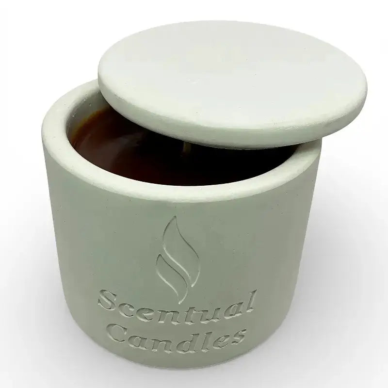 Australian Sandalwood Candle in a white container with a lid on a white background, branded 'Scentual Candles'.