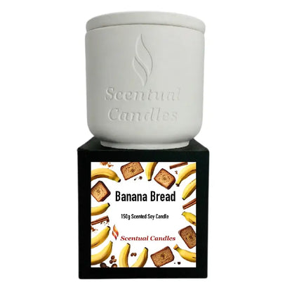 Banana Bread Candle in a decorative jar with a label, featuring images of bananas, bread, and spices.