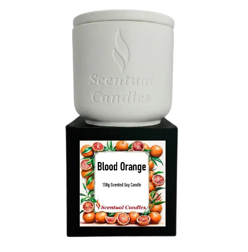 Blood Orange Candle in a white ceramic container with a black label featuring vibrant blood oranges.