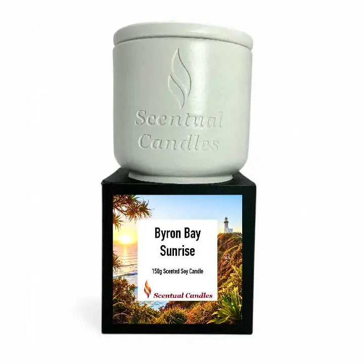 Byron Bay Scented Soy Candle in white container with label depicting Byron Bay Sunrise scene.