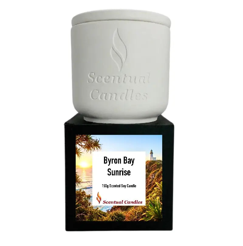 Byron Bay Scented Soy Candle featuring Byron Bay Sunrise fragrance in a decorative white and black container.