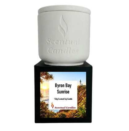 Byron Bay Scented Soy Candle featuring Byron Bay Sunrise fragrance in a decorative white and black container.