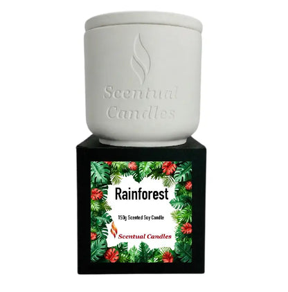 Rainforest Scented Candle in a stylish ceramic container with vibrant tropical design, featuring floral and green accents.