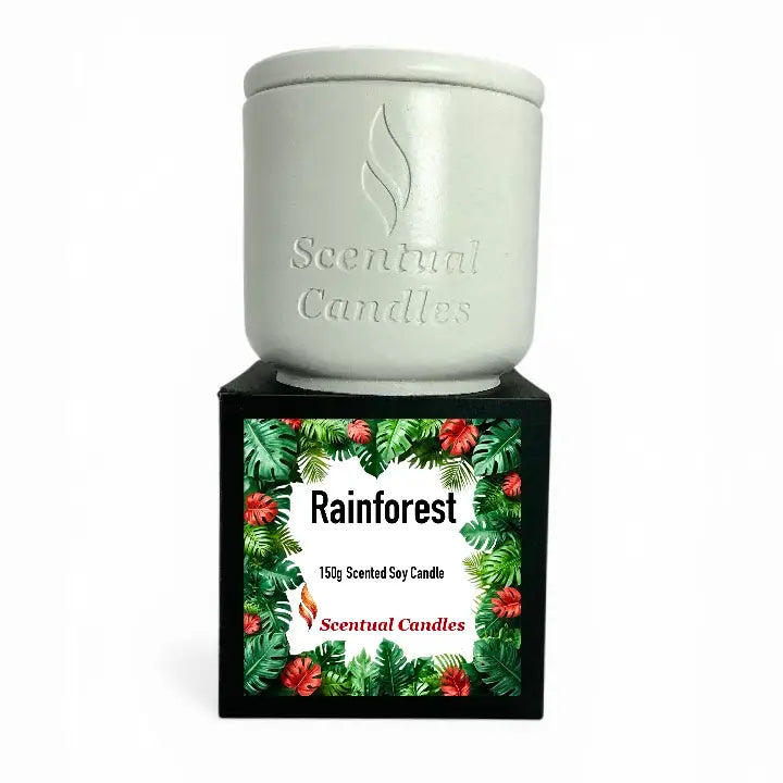 Rainforest Scented Candle in a decorative jar with tropical leaves design, 150g soy candle from Scentual Candles.