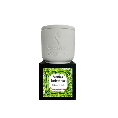 Australian Bamboo Grass scented soy candle by Scentual Candles in a white jar with a black base.