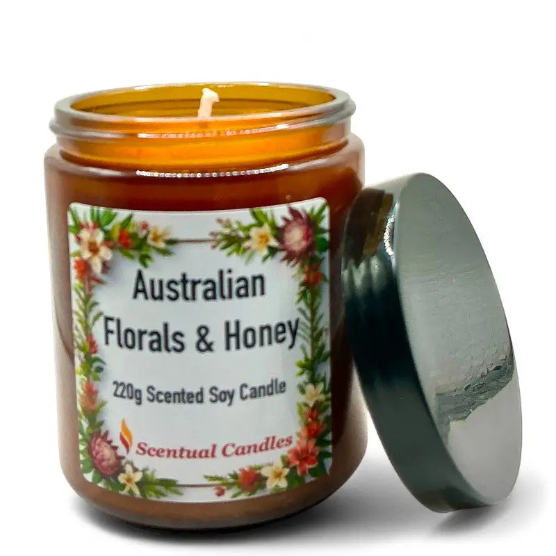 Scented soy candle labeled 'Australian Florals & Honey' with a floral design on a white background