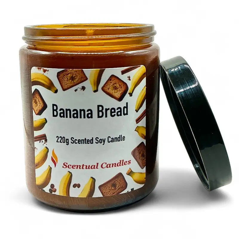 Banana Bread Candle Scented Soy in a jar with black lid, featuring cozy bakery aroma label and images of banana and bread slices.