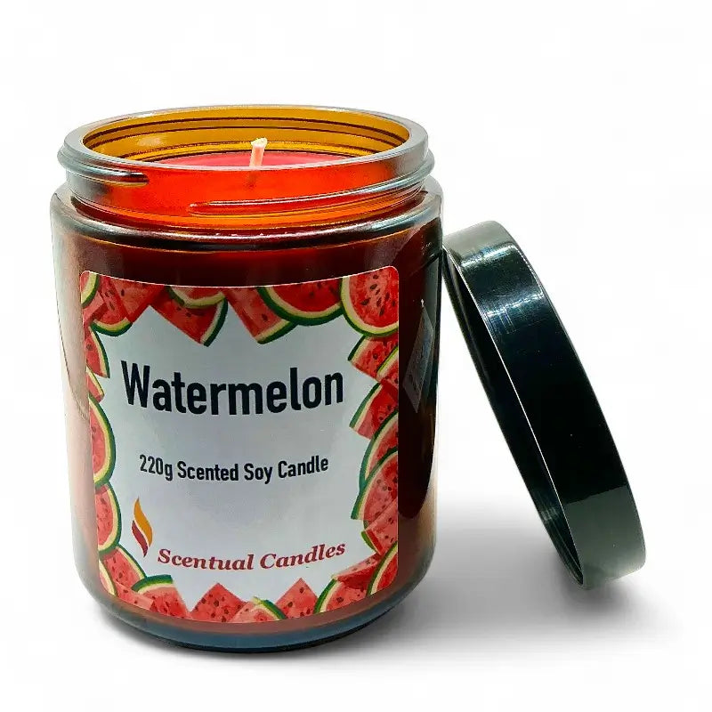 Watermelon candle in a jar with a visible label on a white background