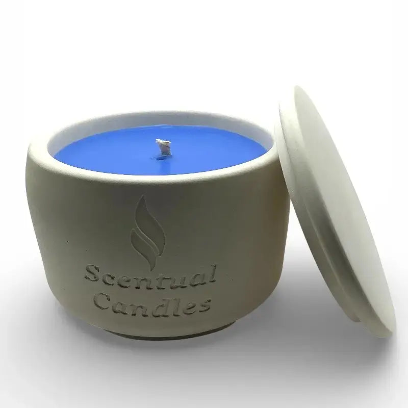 Australian Beach scented candle in a Scentual candles container with blue candle inside on a white background