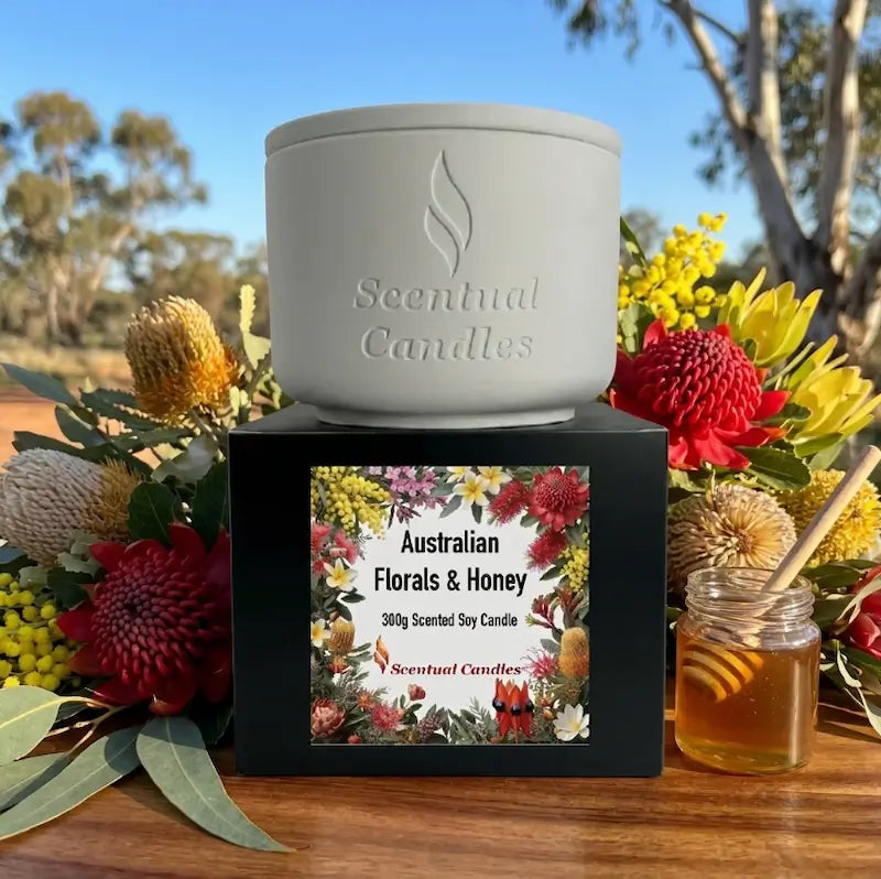 Australian Florals and Honey scented soy candle by Scentual Candles with floral design packaging.