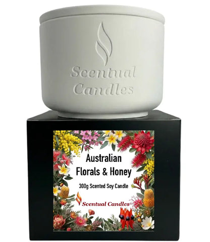 Australian Florals and Honey scented soy candle by Scentual Candles with floral design packaging.