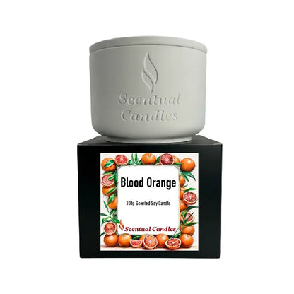 Blood Orange Candle in a stylish container with vibrant blood orange fruit design, showcasing a premium scented soy product.