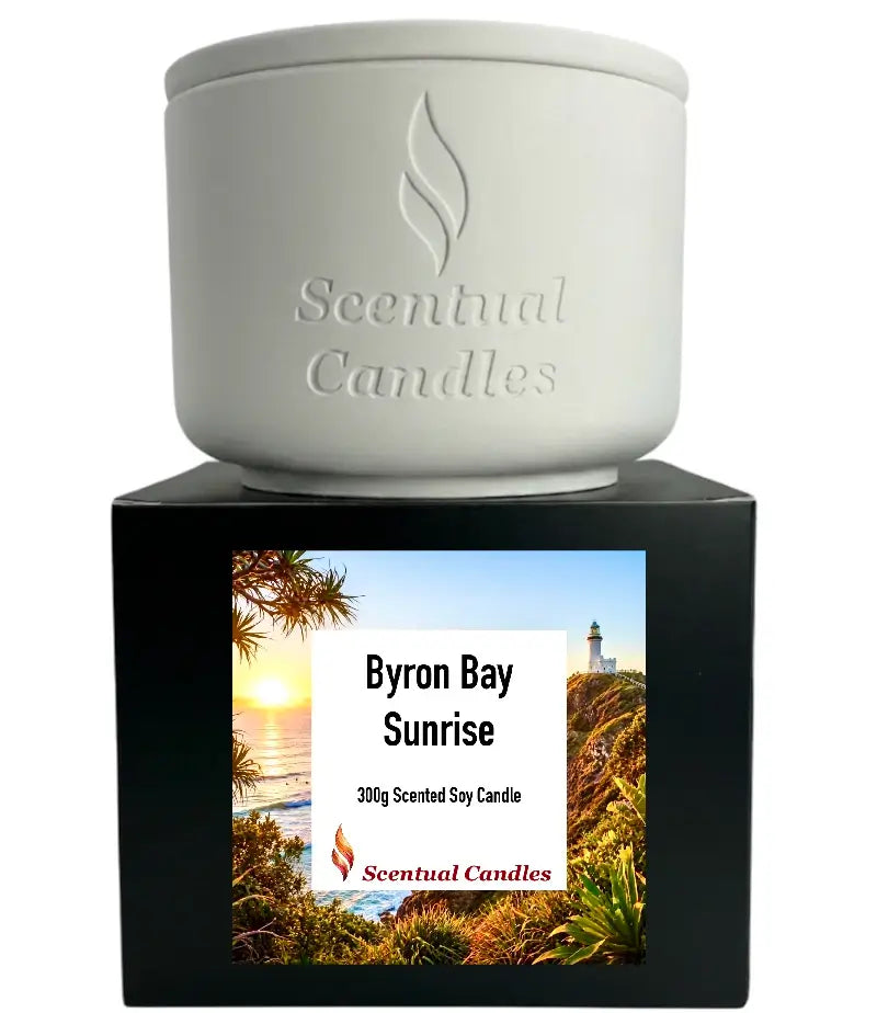 Byron Bay Scented Soy Candle in a white jar on a decorative box featuring Byron Bay Sunrise image.