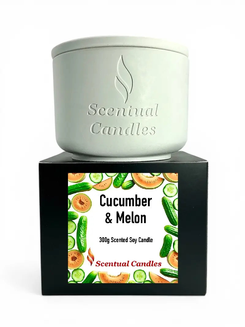 Cucumber and Melon Scented Soy Candle in a stylish pot with a decorative label showcasing cucumbers and melons.