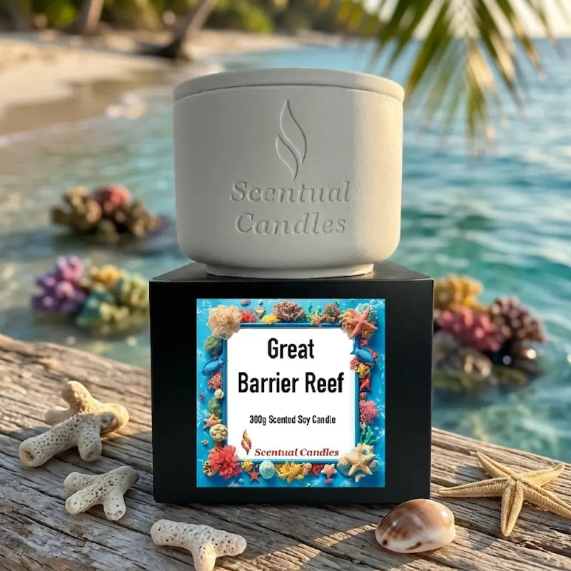 Tropical Scented Candle Great Barrier Reef displayed on a beach with coral and seashells.