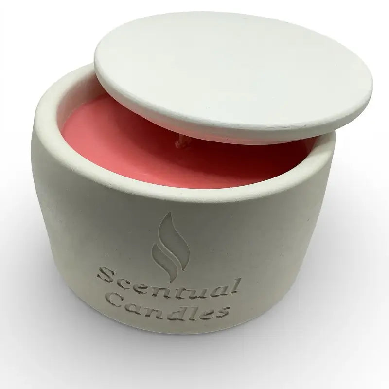 Pink Honeysuckle scented candle in a white container with 'Scentual Candles' branding on a white background