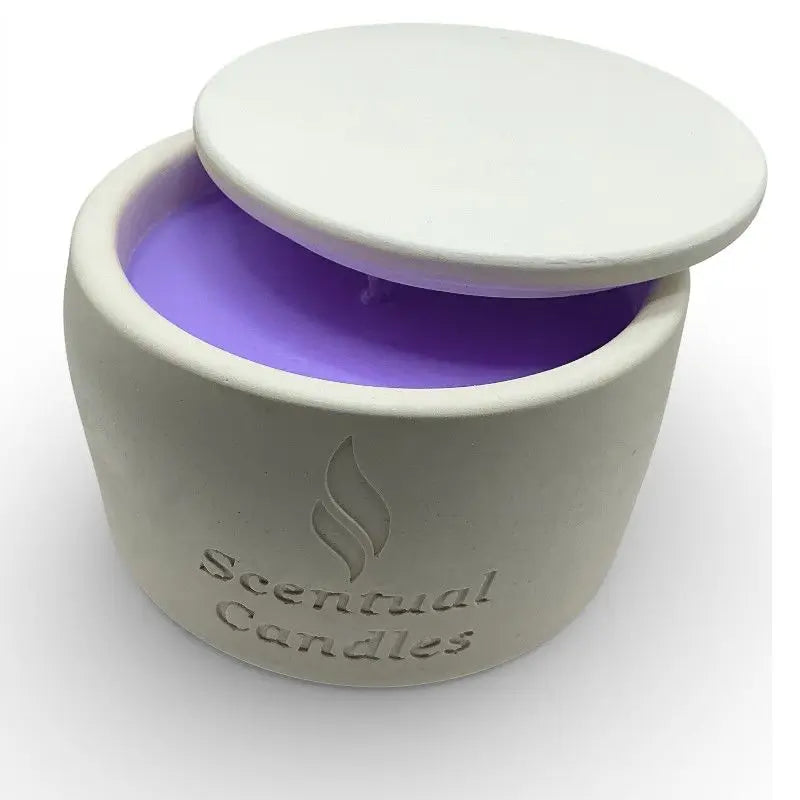 Lavender candle in a white ceramic jar with purple candle inside, branded 'Scentual Candles', on a white background