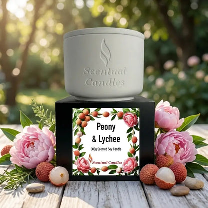 Lychee Scented Candle in a white container with Peony and Raspberries label, showcasing a vibrant design.