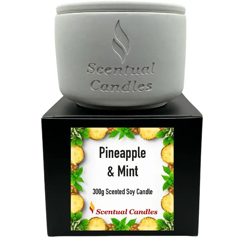 Pineapple and Mint scented soy candle in elegant packaging, offering a tropical fragrance blend for a refreshing ambiance.