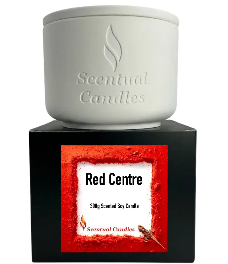 Spicy Vanilla and Buddhawood 'Red Centre' candle in a white holder with black packaging, part of the Australian Scents Collection.