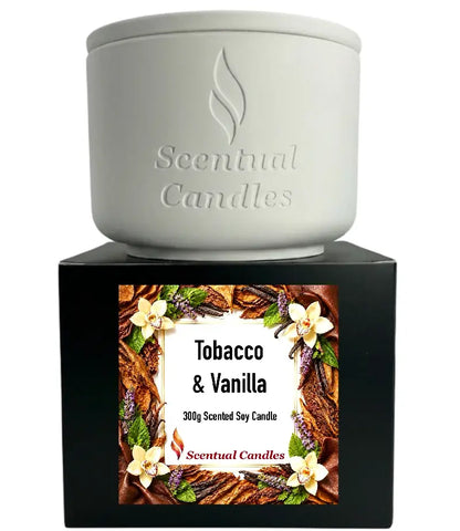 Tobacco Scented Candle in white container with floral design, showcasing rich tobacco and vanilla scent.