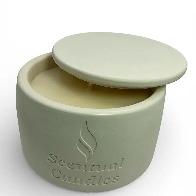 Vanilla Patchouli and Sandalwood scented soy candle in an elegant ceramic jar with lid.