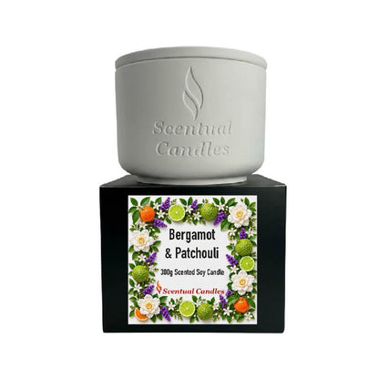 Bergamot Candle with Patchouli in a stylish container by Scentual Candles, featuring a floral design and earthy vibes.