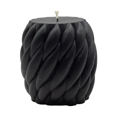 Black vanilla braided candle on a white background