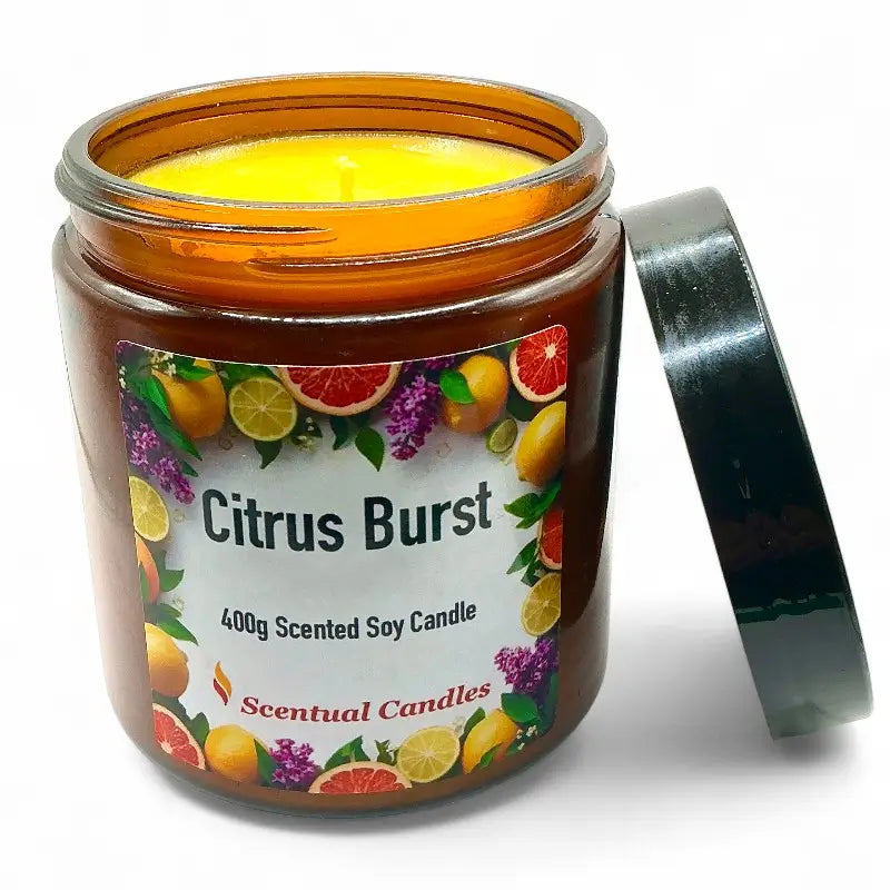 Citrus candle in an amber jar with a colorful label on a white background